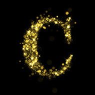 Sparkling letter C of glittering stars bokeh