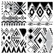 Set of four hand drawn tribal seamless patterns