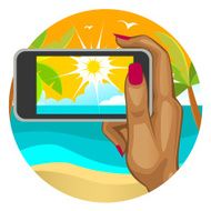 Woman&#039;s hand with the smart phone on beach