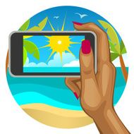 Woman&#039;s hand with the smart phone on beach N2