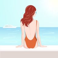 Girl in swimsuit looking at the sea