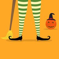 Halloween witch legs and broom