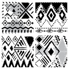 Set of four hand drawn tribal seamless patterns