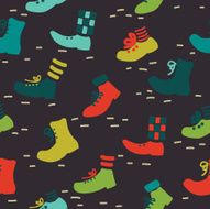 Vector seamless pattern made of various stylish shoes