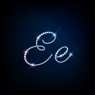 Diamond glittering letter E of sparkling brilliants