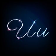 Diamond glittering letter U of sparkling brilliants