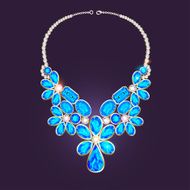 woman&#039;s necklace with precious stones
