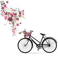 Bike with a basket in decorative flowers
