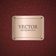 Metal label on leather background
