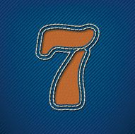 Number 7 made from leather on jeans background