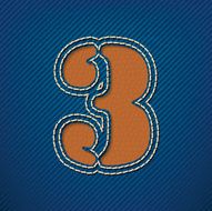 Number 3 made from leather on jeans background