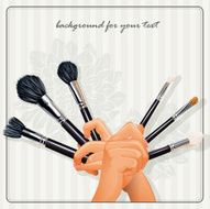 The image of hands holding a brush for makeup