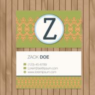 Business card with alphabet letter on a wood background