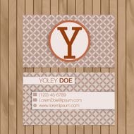 Business card with alphabet letter on a wood background N2