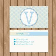 Business card with alphabet letter on a wood background N3