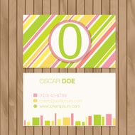 Business card with alphabet letter on a wood background N5