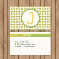Business card with alphabet letter on a wood background N6