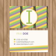 Business card with alphabet letter on a wood background N7