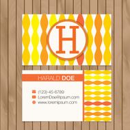 Business card with alphabet letter on a wood background N8