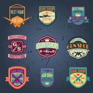 Pop art gun shop logotypes and badges vector set