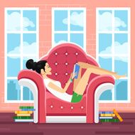 Cute young woman in chair reading book N2