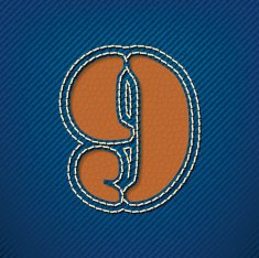 Number 9 made from leather on jeans background