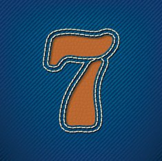 Number 7 made from leather on jeans background