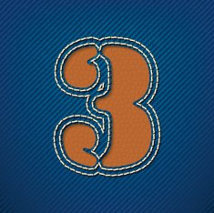 Number 3 made from leather on jeans background