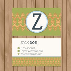 Business card with alphabet letter on a wood background