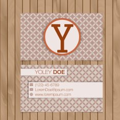 Business card with alphabet letter on a wood background N2