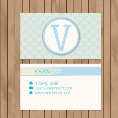 Business card with alphabet letter on a wood background N3