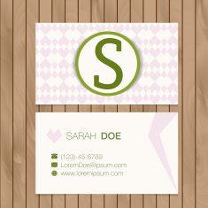 Business card with alphabet letter on a wood background N4
