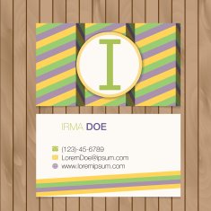 Business card with alphabet letter on a wood background N7