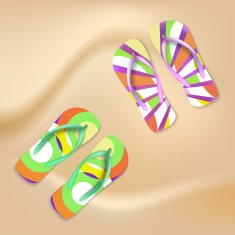 Colored beach slippers the sandy background