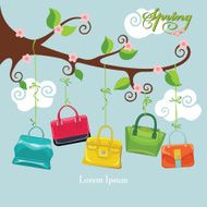 Spring flowering branch and colored handbags