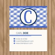 Business card with alphabet letter on a wood background N11