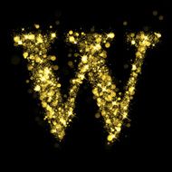 Sparkling letter W of glittering stars bokeh