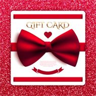 Gift card with red bow on glitter background