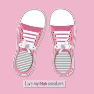 Pair of pink sneakers on background N2