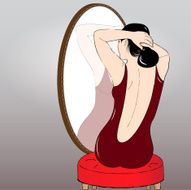 Beautiful girl making hair bun before a mirror