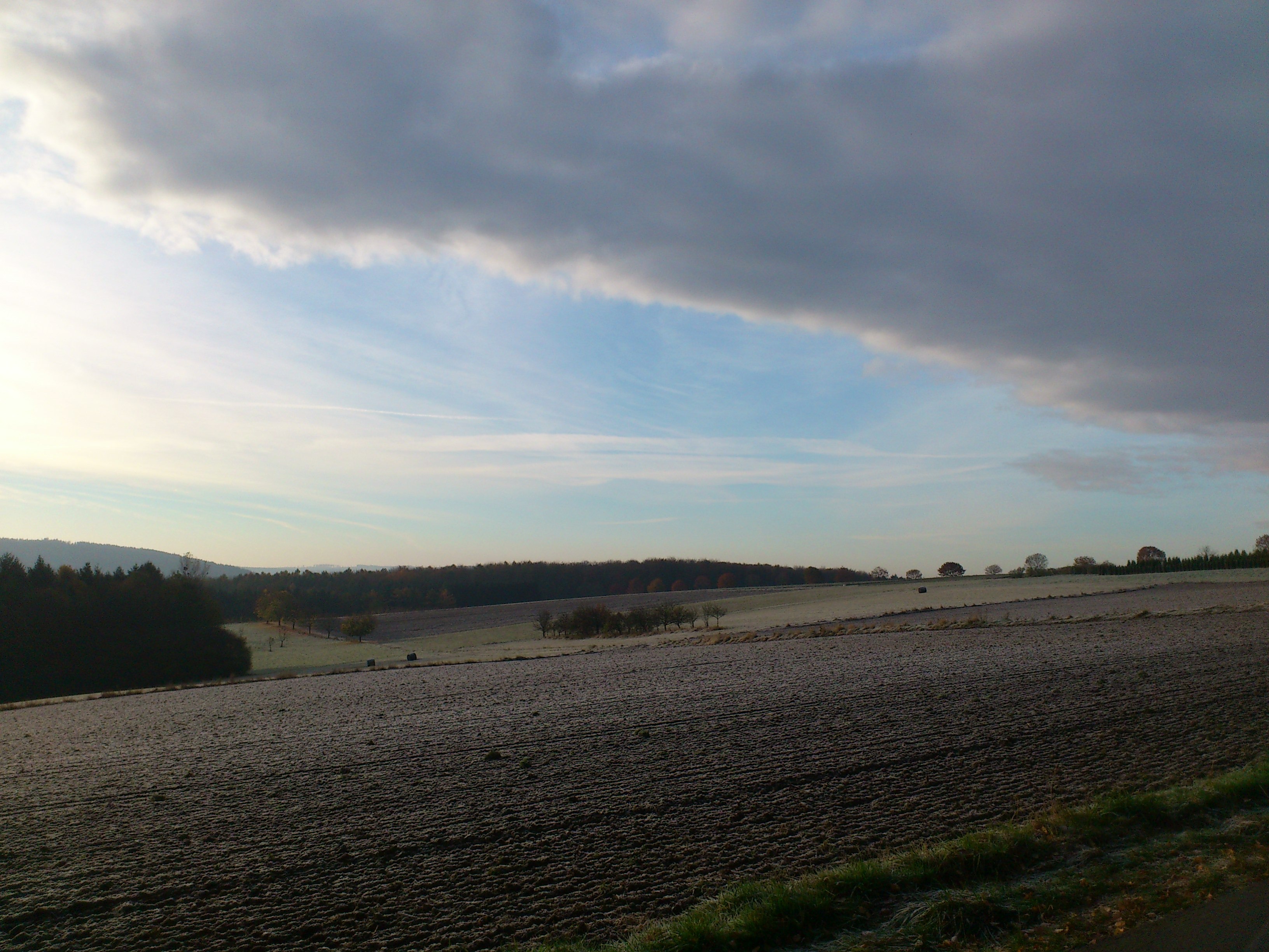 Winter sky over a field in Germany free image download