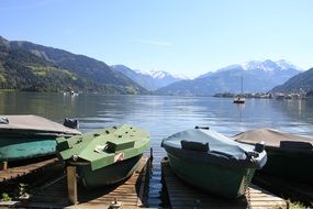 landscape of boats on the lake among the alps