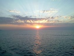 sun on the sea horizon in italy