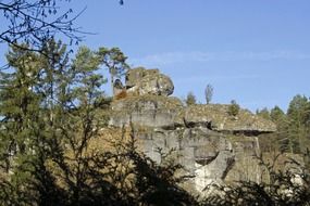 rocky formations in the forest in bright sun