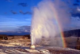 Landscape of yellowstone geyser and rainbow