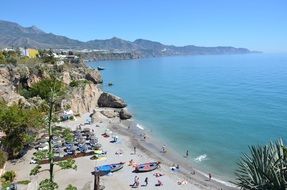 sea beach with people and mountains summer panorama view