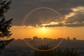 morning sun behind the clouds