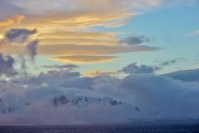 white clouds on the sky in antarctica