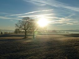 bright sun over the arable field