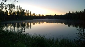 fog over evening lakes in Finland